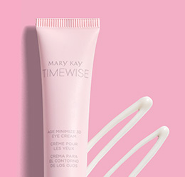 A picture of a small pink tube and a smear of TimeWise® Age Minimize 3D® Eye Cream