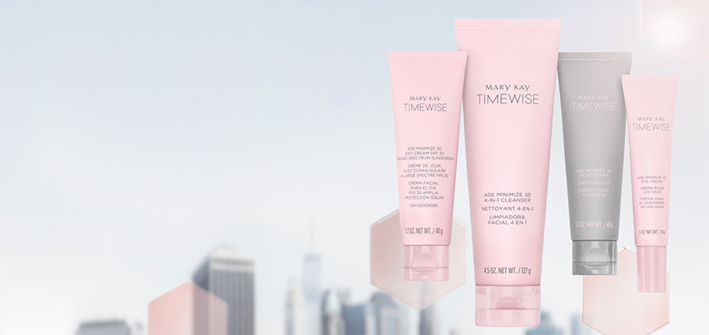 Mary Kay’s new TimeWise Miracle Set 3D skin care regimen floats in front of pink translucent hexagons on an image of a city skyline.