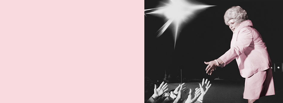 Mary Kay Ash reaches out to independent sales force members in the audience at the annual Mary Kay Seminar.