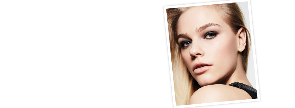 Get the step-by-step application tips for the In the Nude Look created by Mary Kay Guest Makeup Artist Sam Addington. In the right corner there is a tilted rectangle featuring a blond woman. She is wearing a mixture of brown and grey eye shadow with a light tan lipstick.