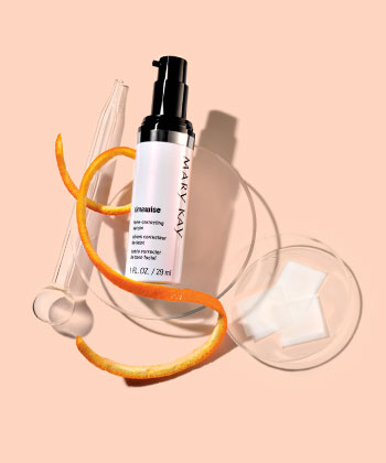 Learn how NEW TimeWise Vitamin C Activating Squares from Mary Kay work by using breakthrough technology to deliver pure vitamin C to your skin in a tiny, dissolvable square that’s mixed with your serum for an age-fighting boost. In just two weeks, skin looks more radiant and even-toned, and fine lines and wrinkles look improved. Image shows a light orange background. In the image are two clear bowls of different sizes. In the larger bowl is the TimeWise Tone Correcting Serum with a thin orange peel twirled by it. In the smaller bowl are several squares of the new TimeWise Vitamin C Activating Squares.