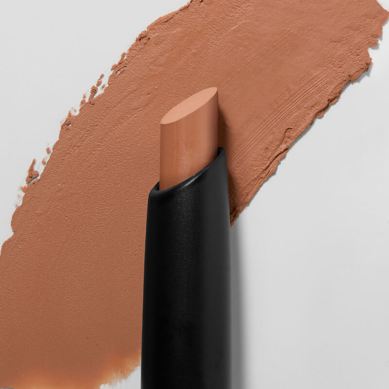 Mary Kay&reg; Matte&nbsp;Eye Shadow Stick in Orbit Clay, slanted tip in foreground, swatch in background.