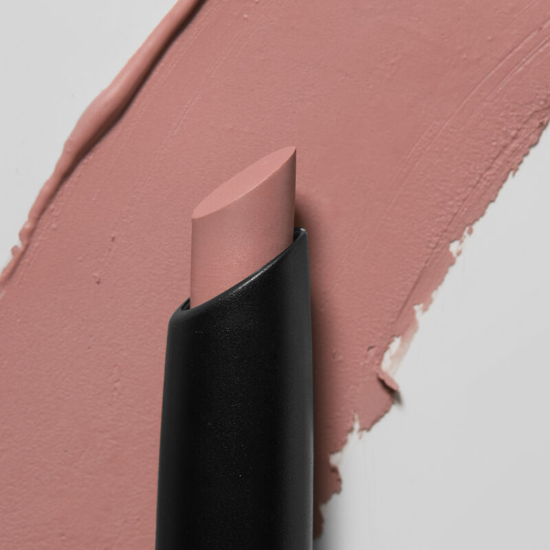 Mary Kay&reg; Matte Eye Shadow Stick in Lunar Rose, slanted tip in foreground, swatch in background.