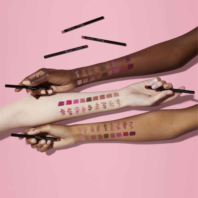 Fair-, medium- and deep-skinned arms with shade swatches of all shades of Mary Kay Waterproof Lip Liner against pink background