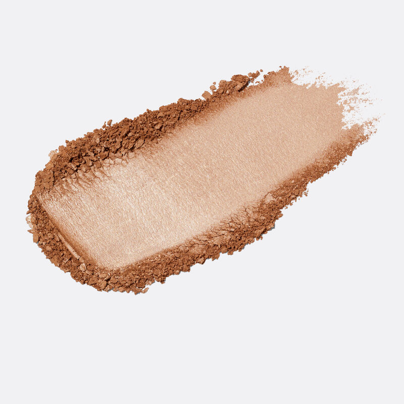 Product rub of limited-edition Mary Kay Illuminating Bronzer in shade Medium Glow against plain background