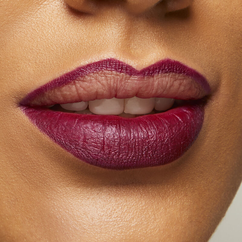 Medium skinned woman wearing Mary Kay Waterproof Lip Liner in Berry