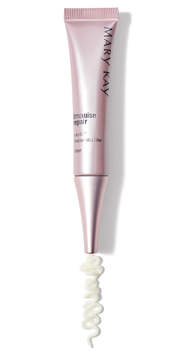 Mary Kay skincare products including eye patches, gel mask, and tubes arranged on a pink surface